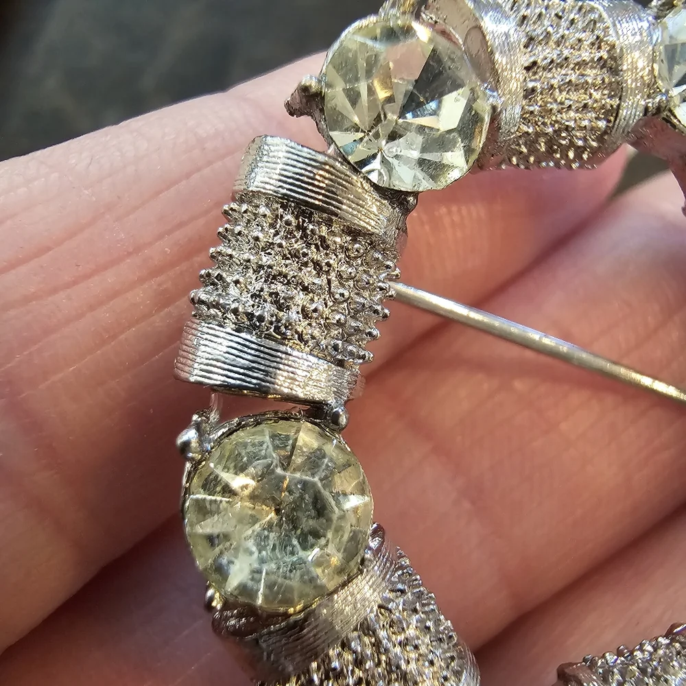 Vintage silvertone and Rhinestone circular brooch